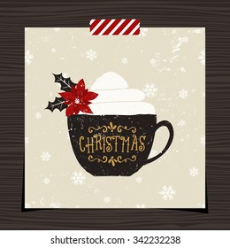Christmas greeting card template design on wood background. A black coffee cup with typographic design and whipped cream decorated with poinsettia on snowflake pattern background.