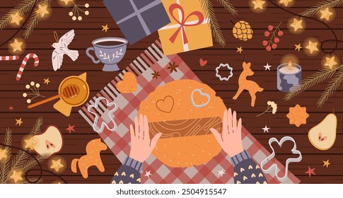 Plantilla de la tarjeta de felicitación de las Navidades con las manos de la masa de amasar y las galletas de la decoración, taza de té, guirnalda con las estrellas y decoraciones estacionales festivas que yacen en la mesa. Vista superior. Ilustración plana de Vector