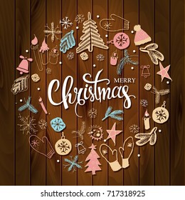 Christmas greeting card with text wish you a Merry Christmas and wreath with many winter doodles. Santa, toys, cookies, snowmen, fir, candies, socks, gifts, bows, snowflakes, hollies mittens