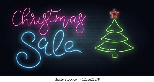 Christmas greeting card, vector background. Christmas lettering in Neon style on brick background. Blue and Purple neon colors, neon stars and xmas fir-tree. Hand drawn lettering. Vector