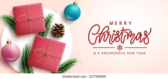 Christmas greeting vector design. Merry christmas typography text with gifts and leaves in podium elements for xmas holiday season gift present. Vector illustration.
