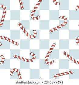 Christmas groovy seamless pattern with candy cane on blue checkerboard background. Retro background for wrapping paper, invitation, greeting card, textile. Vector illustration