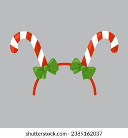 El pelo de Navidad se cuelga con dos latas de caramelo y arcos verdes. Divertido, discurso de invierno para fiestas, festival, carnaval, vacaciones. Estilo de caricatura. Atributo del disfraz. Vector aislado.