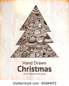 La mano de Navidad dibujó un árbol de piel para diseño navideño con adornos.