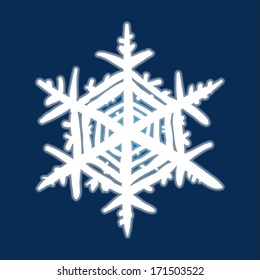 Christmas hand-drawn snowflake on deep blue background.
