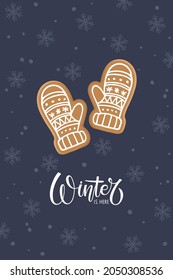 Christmas or Happy new year card with Gingerbread knitted mittens cookie and handwritten text Winter is here. Winter Holiday symbol. Flat vector isolated ondark blue background with snowflakes.