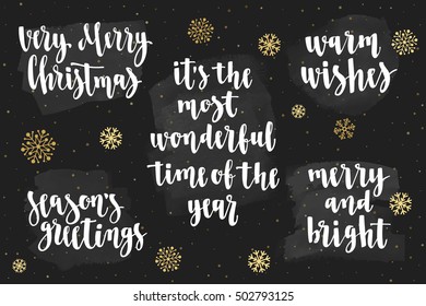 Christmas and Happy New Year greeting holidays lettering with snowflakes. Set of handwritten brush calligraphy for cards, flyers and posters. Vector elements for design on chalkboard dark background.