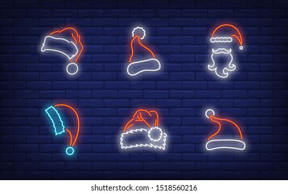 Christmas hat neon sign set. Red Santa Claus cap, beard, moustache, fur. Vector illustration in neon style, bright banner for topics like Xmas, costume, December holidays