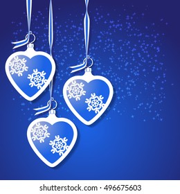Christmas heart toys with snowflakes on blue