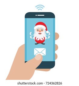 Christmas is here. Send your letter to santa claus from your cell phone. Hand holding smartphone. 