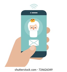 Christmas is here. Send your letter to The three wise men of orient from your cell phone. Hand holding smartphone. Melchior