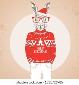 Christmas Hipster fashion animal rabbit dressed in New Year hat and pullover
