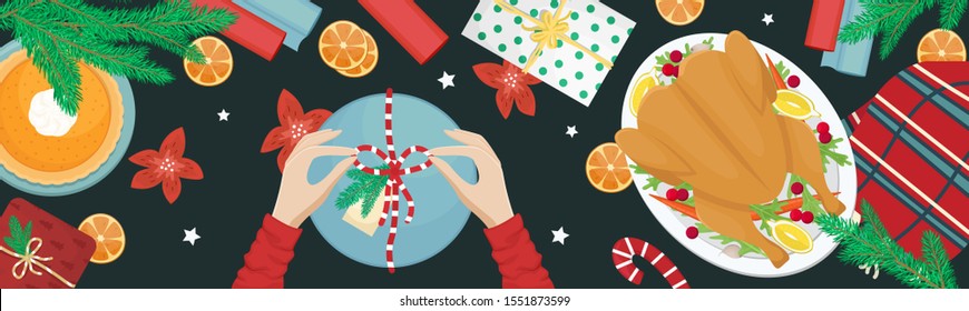 Christmas holiday dinner. Flat lay with turkey with cranberries, pumpkin pie, oranges, fir branches and gifts. Girl packing a gift.