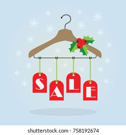 Christmas Holiday red hanging SALE tags on clothing hanger with mistletoe decoration icons on blue gradient background