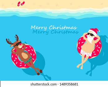 Christmas holiday. Santa Claus and deer Rudolph relaxing on inflatable donuts. Greeting Christmas card 2021