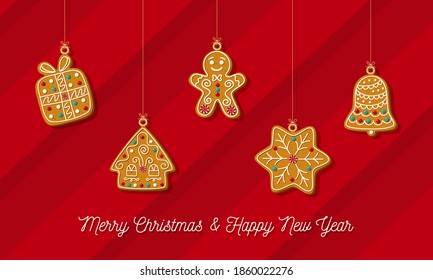 Christmas horizontal banner with hanging homemade gingerbread on a red background.