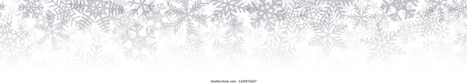 Christmas horizontal seamless banner or background of many layers of snowflakes of different shapes, sizes and transparency. Gradient from gray to white