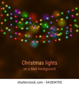 Christmas house lights on a dark background. Luminous garlands for greeting cards, invitations and gift cards