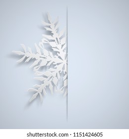 Christmas illustration with one white big snowflake which protrudes from the cut on a light blue background