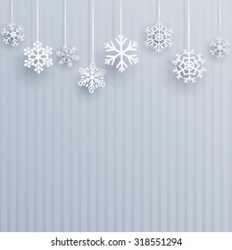 Christmas illustration with several hanging snowflakes on light blue striped background