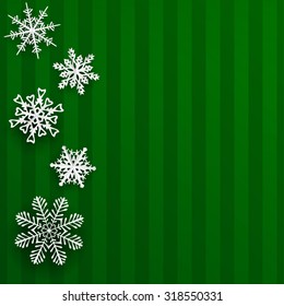 Christmas illustration with snowflakes cut out of paper on green striped background