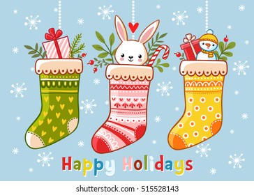 Christmas illustration with christmas socks and gifts in them. Inscription happy holidays on a blue background. Vector illustration. Cute illustration in a children's style.