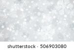 Christmas illustration with white blurred and clear snowflakes on gray background