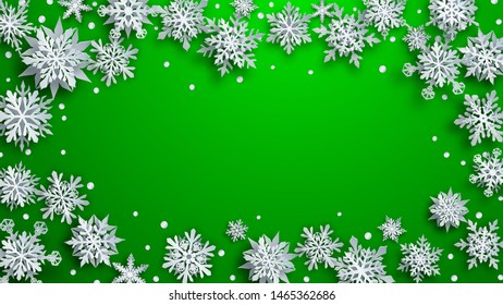 Christmas illustration of white complex paper snowflakes with soft shadows on green background