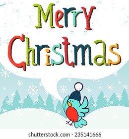 Christmas invitation or greeting card template with funny cartoon bird in a hat with fir trees and snow on the background. Merry Christmas lettering.