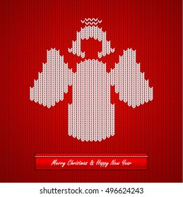 Christmas knitted background with angel