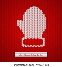 Christmas knitted background with mitten
