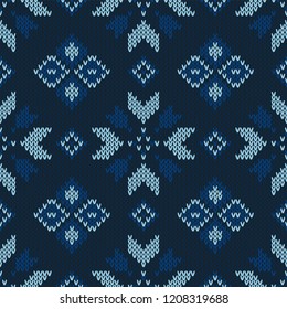 Christmas knitted pattern. Winter geometric seamless pattern. Design for sweater, scarf, comforter or clothes texture. Vector illustration.