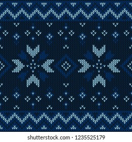 Christmas knitted pattern. Winter geometric seamless pattern. Design for sweater, scarf, comforter or clothes texture. Vector illustration.