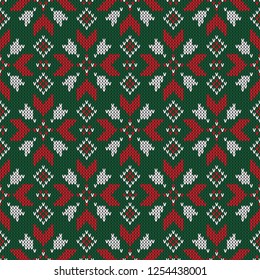 Christmas knitted pattern. Winter geometric seamless pattern. Design for sweater, scarf, comforter or clothes texture. Vector illustration.