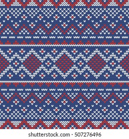 Christmas knitting seamless pattern with nordic ornament in Red, White and Blue. Perfect for wallpaper, wrapping paper, pattern fills, winter greetings, web page background, New Year greeting cards
