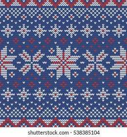 Christmas knitting seamless pattern in Red, Blue and White. Perfect for wallpaper, wrapping paper, pattern fills, winter greetings, web page background, Christmas and New Year greeting cards
