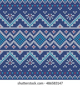 Christmas knitting seamless pattern with rhombus and stars in Red, Blue and White. Perfect for wallpaper, wrapping paper, pattern fills, winter greetings, web page background, New Year greeting cards
