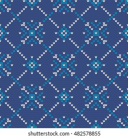 Christmas knitting seamless pattern with snowflakes in White and Blue. Perfect for wallpaper, wrapping paper, pattern fill, winter greetings, web page background, Christmas and New Year greeting cards