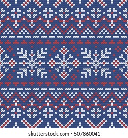 Christmas knitting seamless pattern with snowflakes in Red, Blue and White. Perfect for wallpaper, wrapping paper, pattern fills, winter greetings, web page background, New Year greeting cards