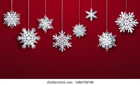 Christmas large complex paper hanging snowflakes on red background