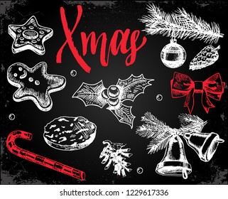 Christmas lettering on a dark background. Merry Christmas Calligraphy. Hand drawn winter symbol. Print for T-shirt, poster, greeting cards. Chalk drawing on on black board