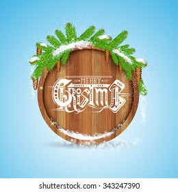 Christmas lettering on round wood border with snowy fir tree branch and cones
