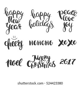 Christmas lettering set. Vector lettering isolated on white. New Year and Christmas greetings hand drawn in calligraphy. 