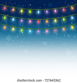 Christmas light bulbs on starry sky background
