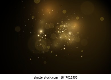Christmas light effect. Sparkling magical dust particles.The dust sparks and golden stars shine with special light.
