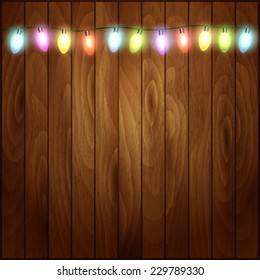 Christmas light on wooden background