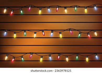 Christmas light on wooden background, holiday decorations with color