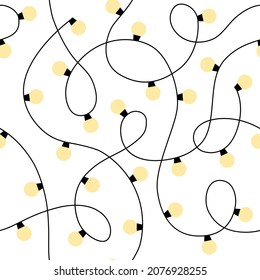 Christmas lights background. Seamless pattern with yellow garlands of light bulbs.