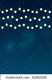 Christmas lights on night sky background