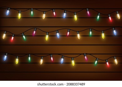 Christmas lights on a transparent background. Garland shining with Christmas lights. Festive decoration element. Bright Christmas lights. The garland is multi-colored. Isolated. Vector illustration.